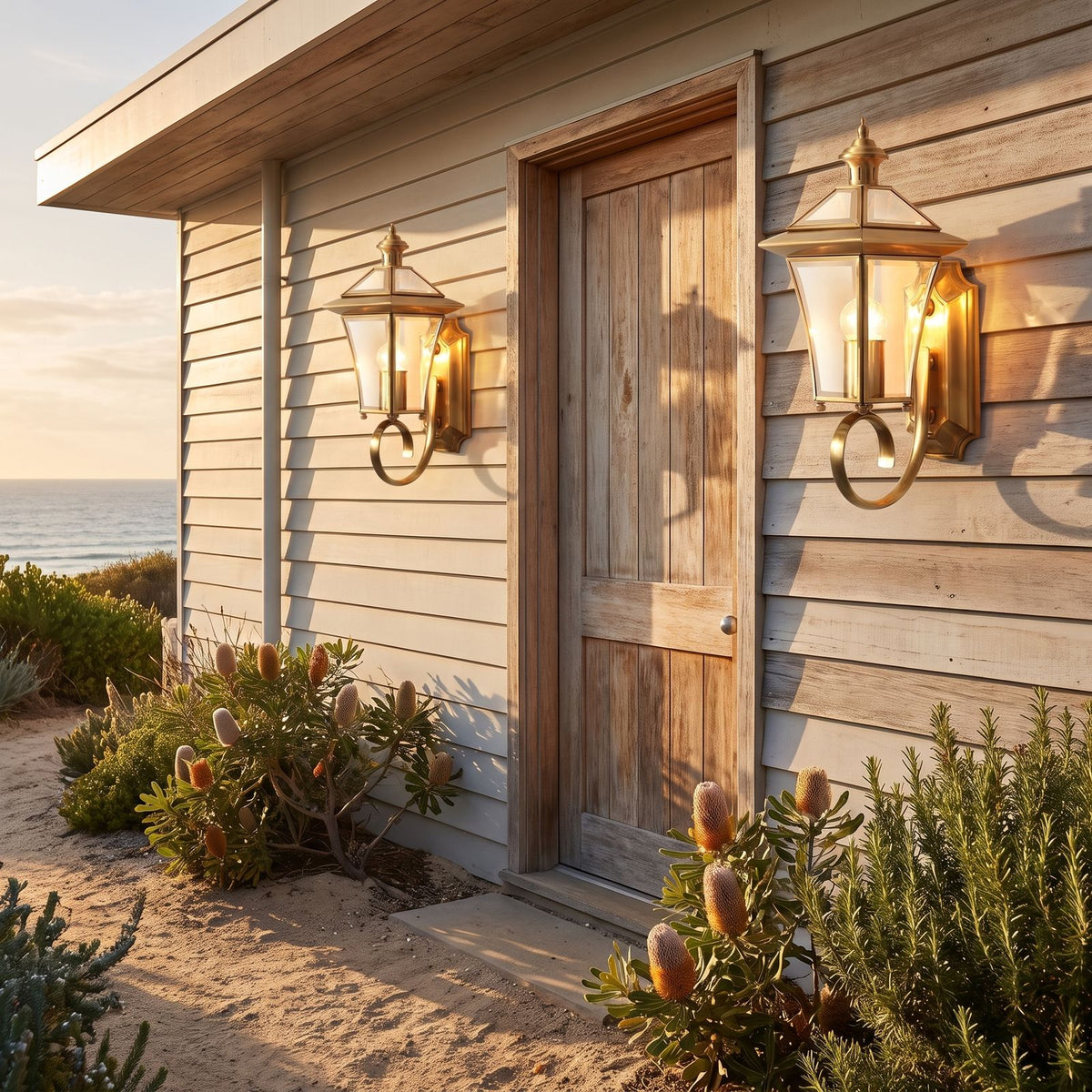 Polished Brass Coastal Outdoor Wall Lantern in a pair either side of an entry door