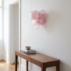 Art Deco Fan Textured Glass Wall Light in pink and blue, lit, with a close view of the textured glass discs