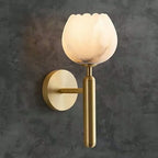 Marble Flower Petal Brass Wall Sconce lit, with close views of the marble petals and a pair beside a bathroom mirror