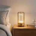 Rechargeable Clear Cylinder Lantern Table Lamp on a bedside table