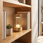 Rechargeable cylinder lantern table lamp on an open shelf in daylight