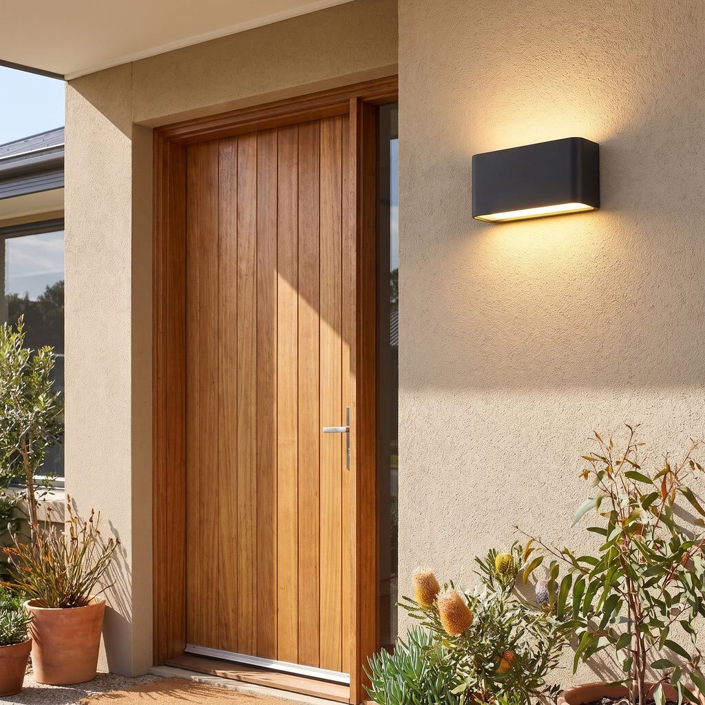 Rectangular Acrylic Up Down Outdoor Wall Light beside a timber front door