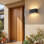 Rectangular Acrylic Up Down Outdoor Wall Light beside a timber front door