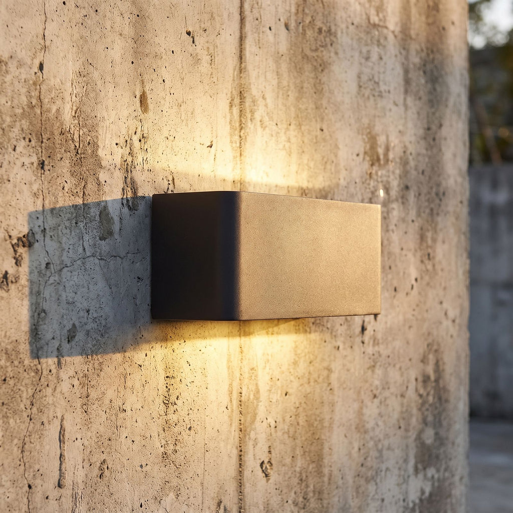 Rectangular Acrylic Up Down Outdoor Wall Light, close view at 45 degrees on a stone wall