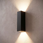 Rectangular Aluminium and Glass Up-Down Wall Light, close view at 45 degrees on a plaster wall