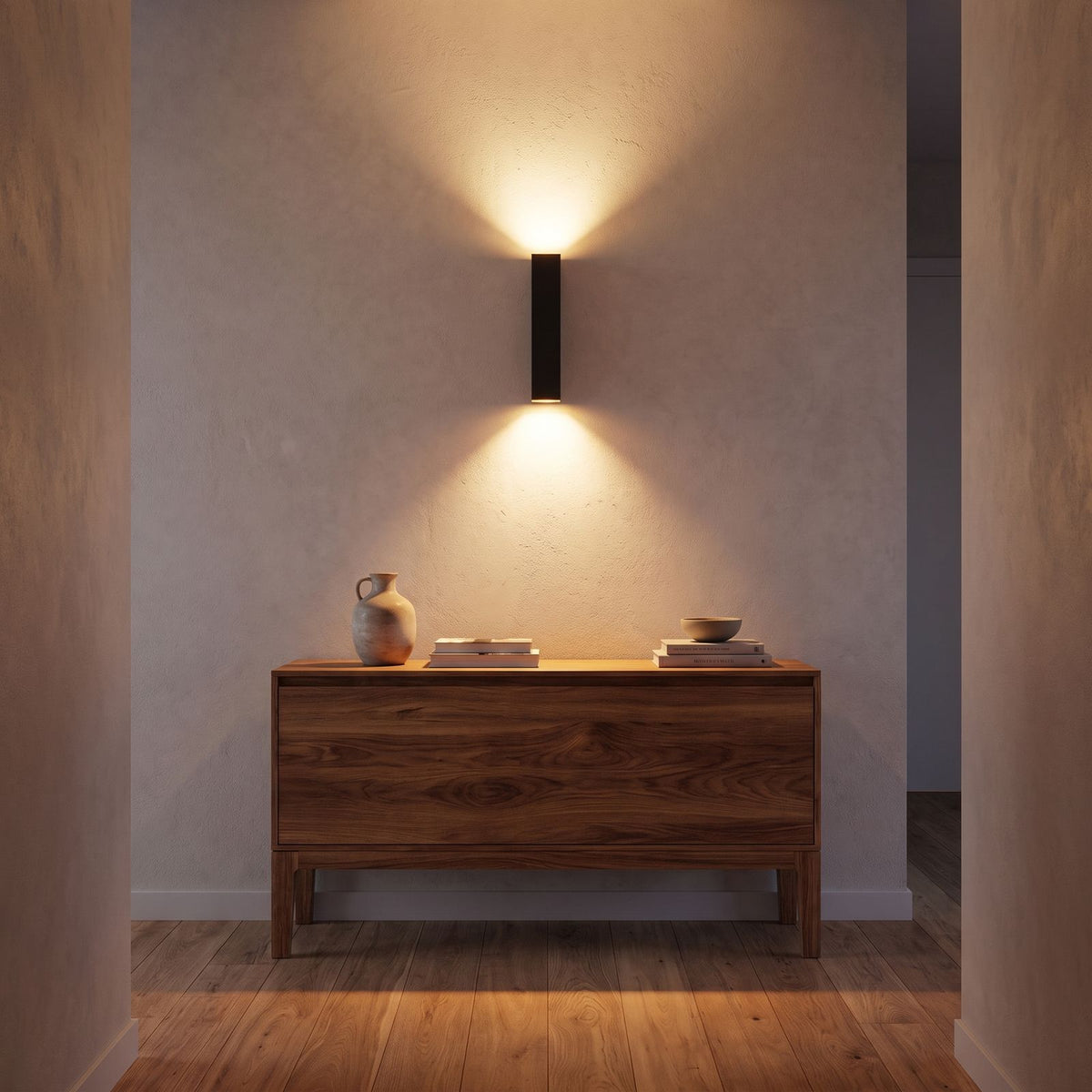 Rectangular Aluminium and Glass Up-Down Wall Light in a hallway above a timber console