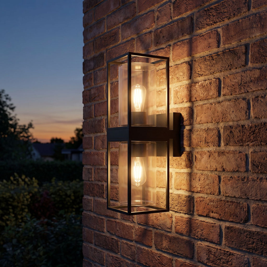 Rectangular Black Metal and Glass Outdoor Wall Light on a porch wall at dusk
