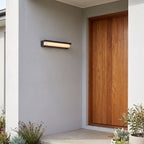 Rectangular Metal and Acrylic Outdoor Wall Light beside a timber front door