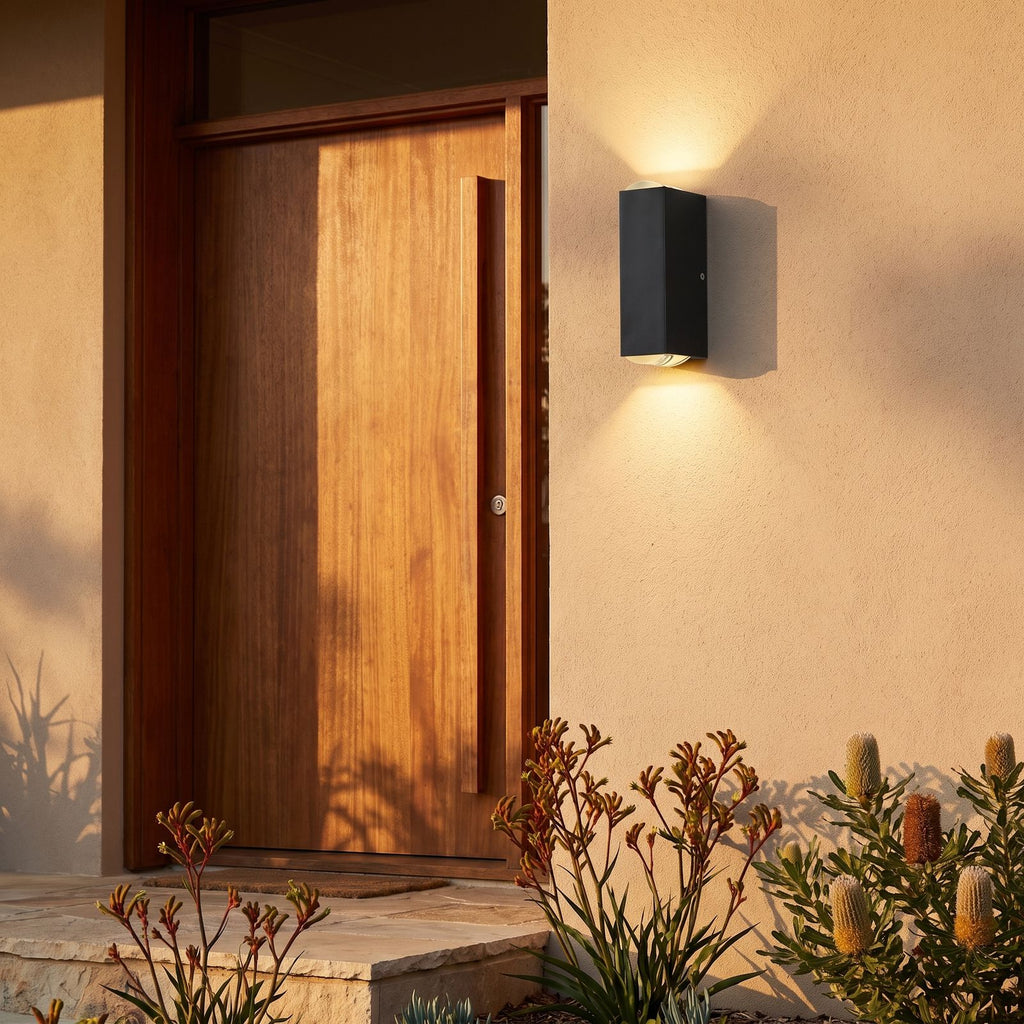 Rectangular Metal Up Down Outdoor Wall Light beside a timber front door