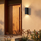 Rectangular Metal Up Down Outdoor Wall Light beside a timber front door