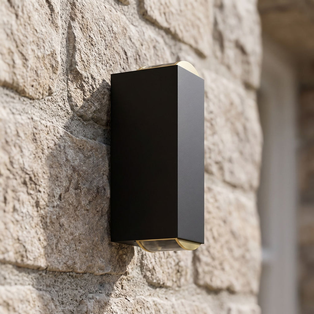 Rectangular Metal Up Down Outdoor Wall Light, close view at 45 degrees on a stone wall