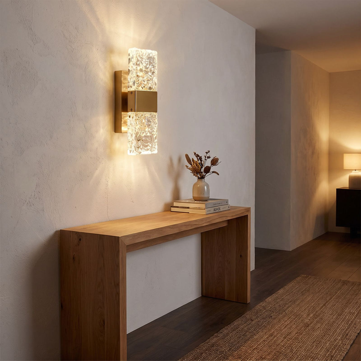 Rectangular Textured Crystal Up Down Wall Light in a hallway above a timber console