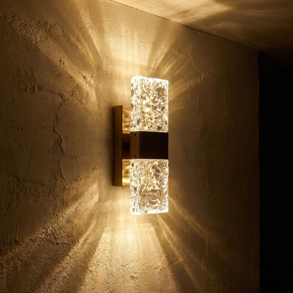 Rectangular Textured Crystal Up Down Wall Light glowing on a plaster wall at night