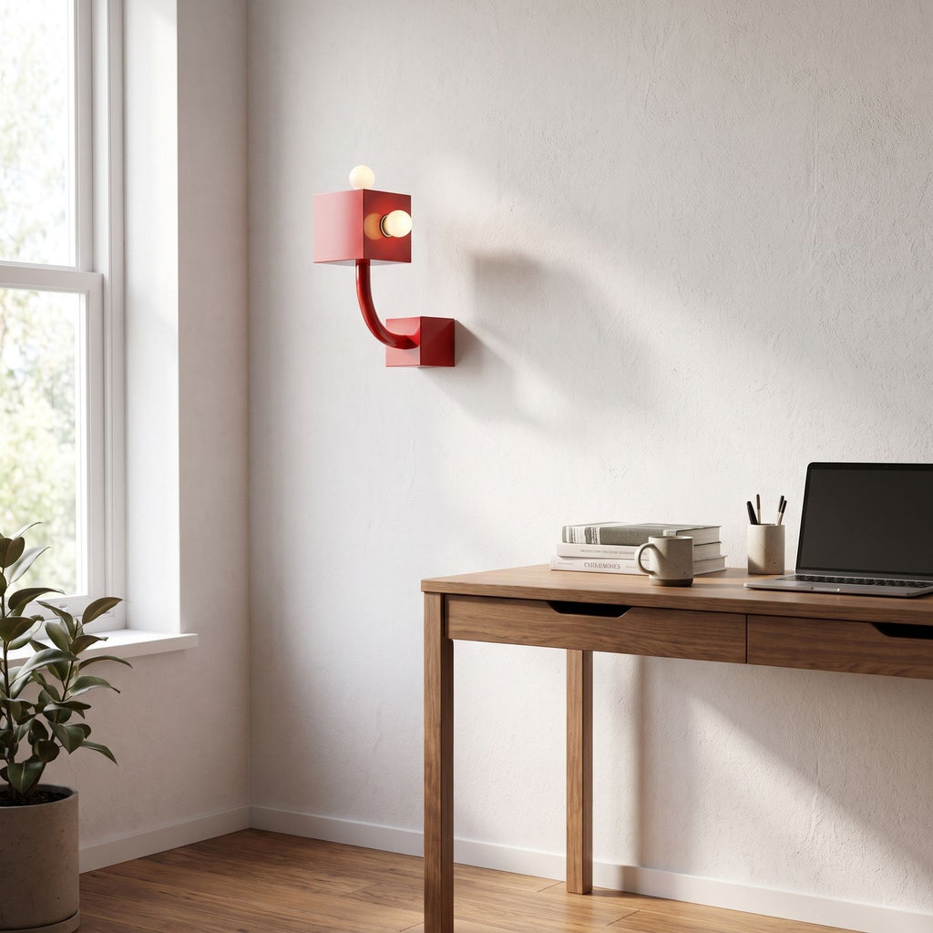 Red Iron Cube Wall Light on a bedroom wall beside the bed