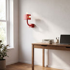 Red Iron Cube Wall Light on a bedroom wall beside the bed
