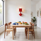 Red Iron Cube Wall Light on a dining room wall