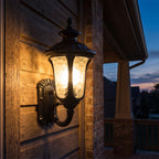 Retro Black Frosted Glass Outdoor Wall Light on a porch wall at dusk