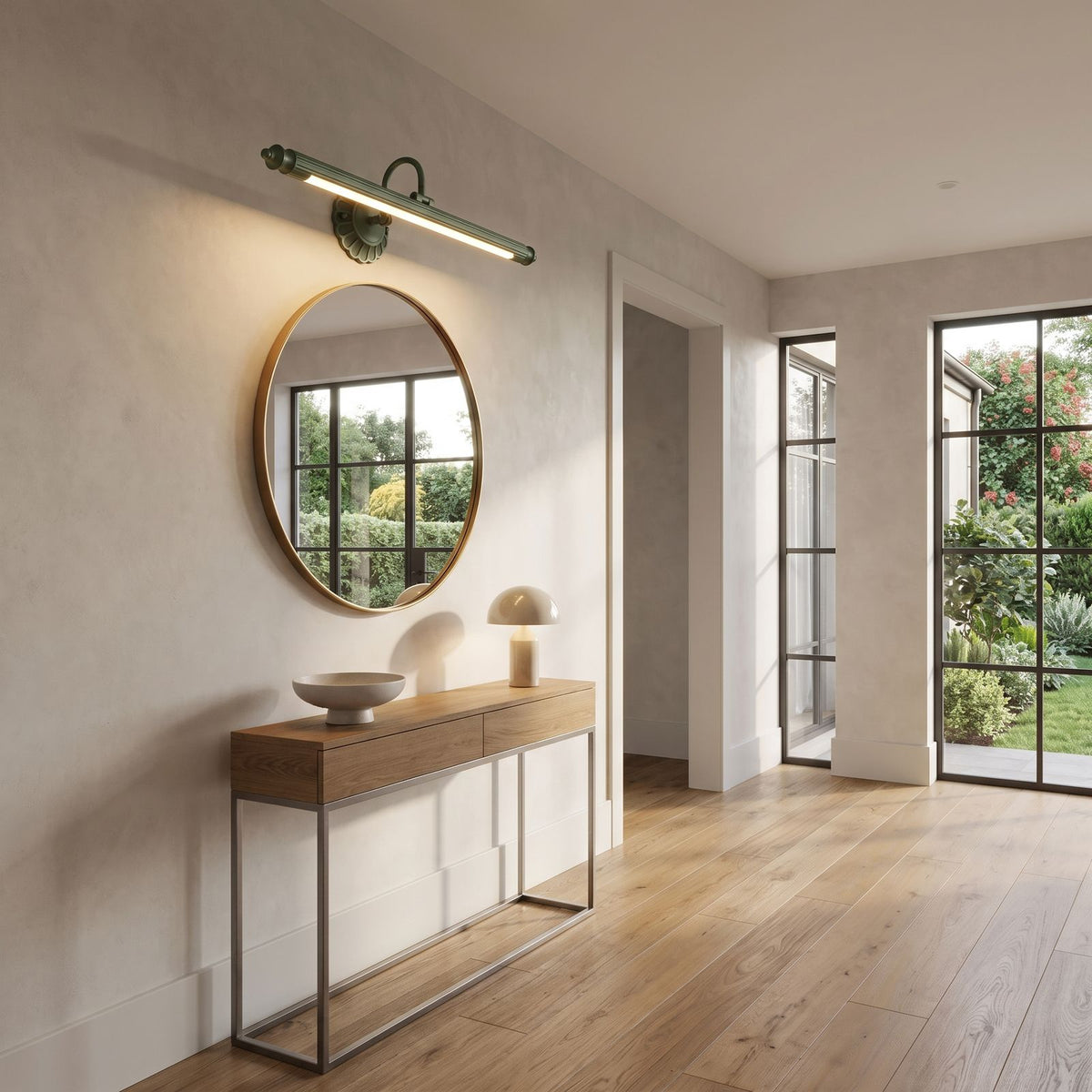 Retro Floral Bronze Cylinder LED Vanity Wall Light above a mirror in a hallway
