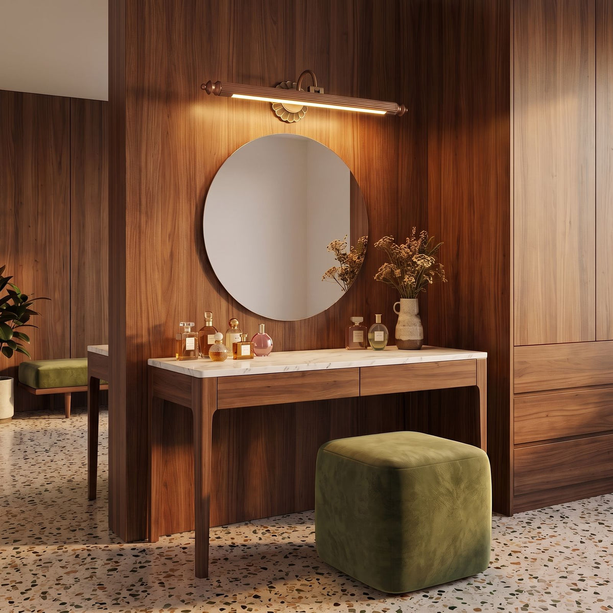 Retro Floral Bronze Cylinder LED Vanity Wall Light in red bronze, above the mirror of a dressing table