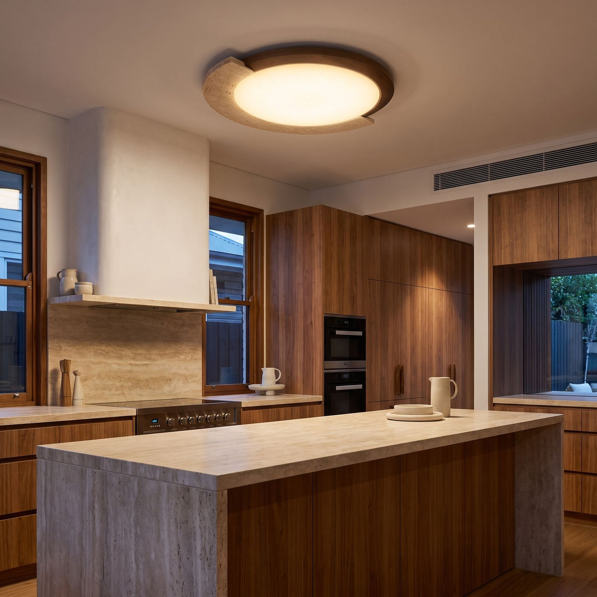 Retro Geometric Stone and Wood Ceiling Light above a stone kitchen bench
