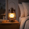 Retro Iron Lantern Rechargeable Table Lamp on a bedside table