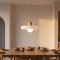 Retro Ribbed Disc and Matte Glass Pendant Light above a dining table