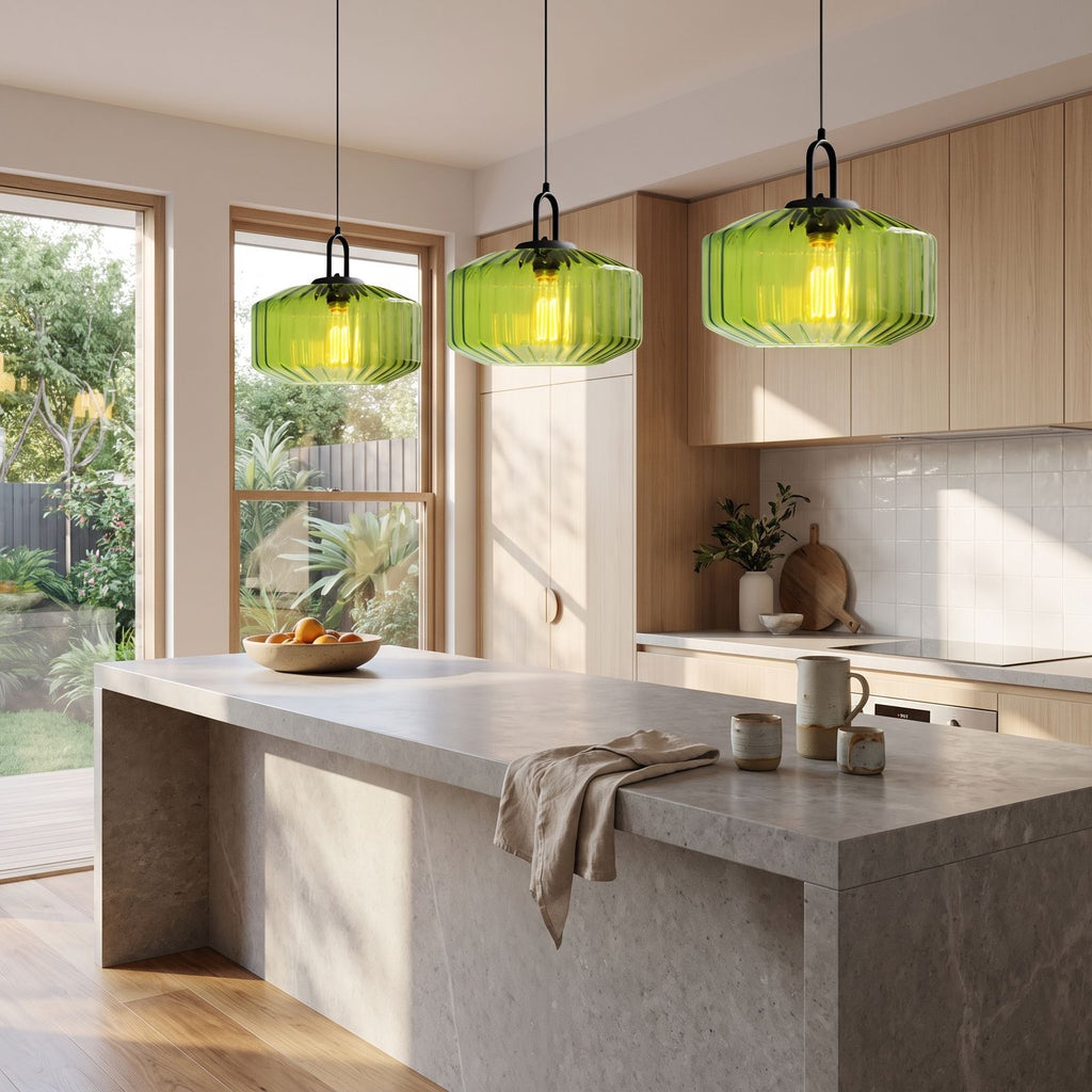 Ribbed Coloured Glass Pendant Light in a row of three over a stone kitchen island