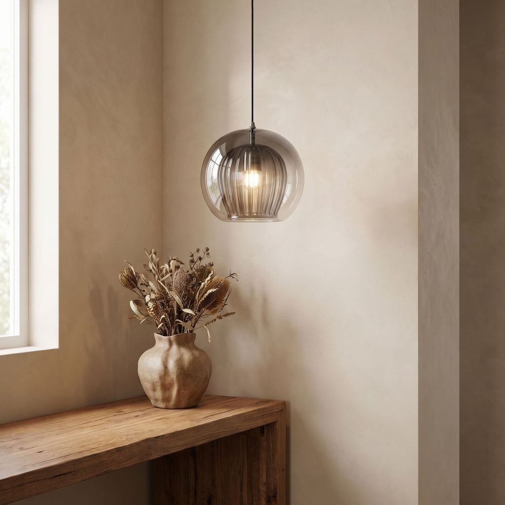 Ribbed Glass Globe Pendant Light above a console in an entry hallway