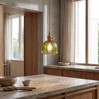 Ribbed tulip glass mini pendant light over a kitchen island in daylight