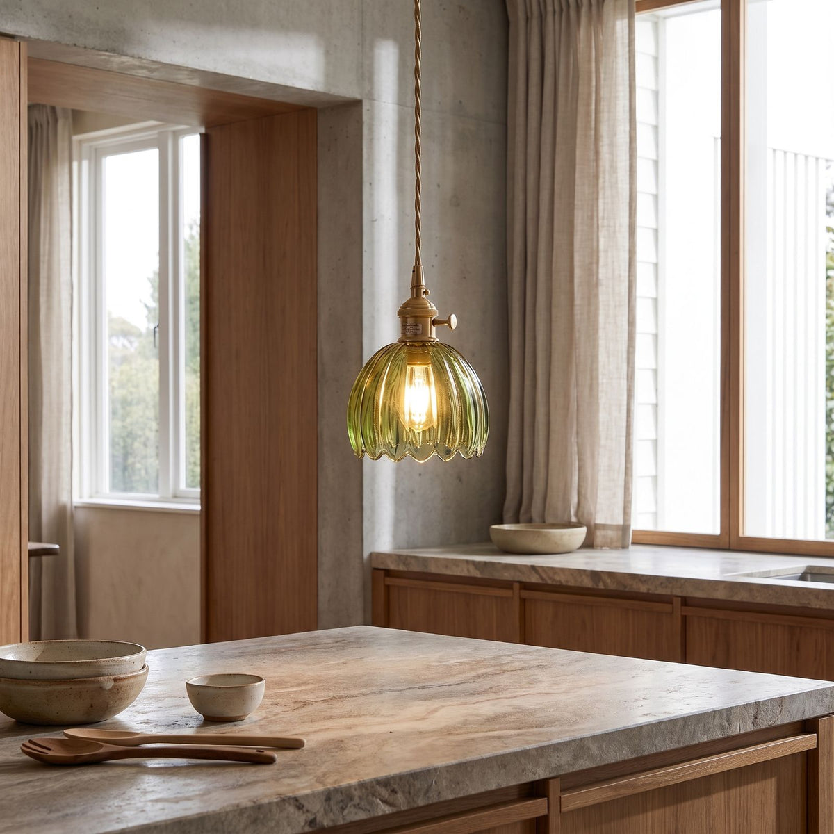 Ribbed tulip glass mini pendant light over a kitchen island in daylight