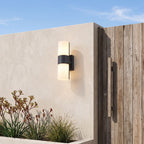 Rotatable Metal Band Acrylic Cylinder LED Outdoor Wall Light beside a timber front door