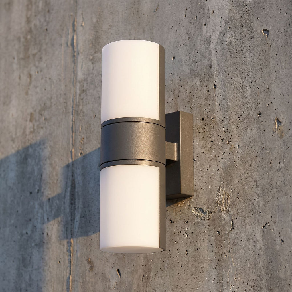 Rotatable Metal Band Acrylic Cylinder LED Outdoor Wall Light, close view at 45 degrees on a stone wall