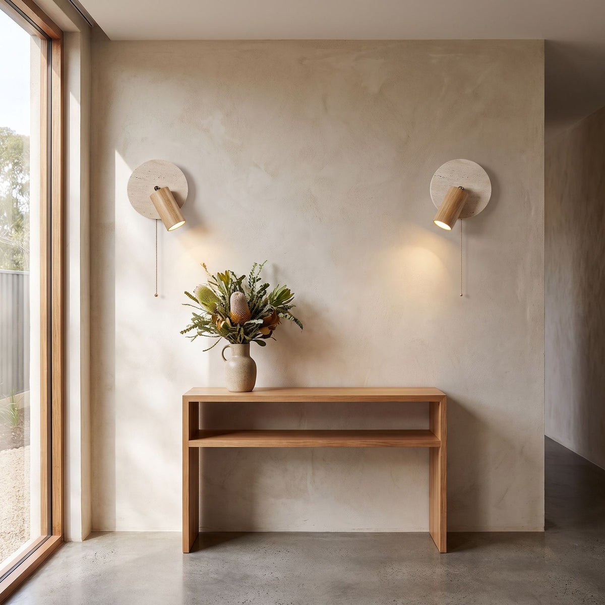Rotatable Travertine Spotlight Wall Light in a pair on a wall of an Australian home