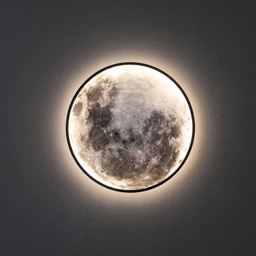 Round 3D Moon Black Frame LED Wall Light close view of the 3D moon face and the black metal ring, switched on