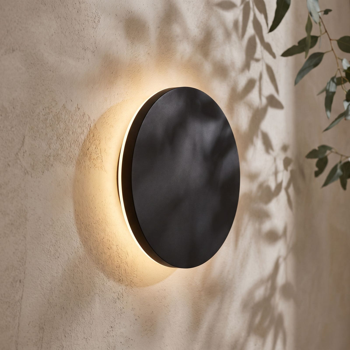 Round Aluminium Disc LED Wall Light, close view on a plaster wall