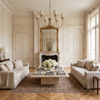 Round Curved Arm Off-White Shade Chandelier above a coffee table in a classic living room in daylight