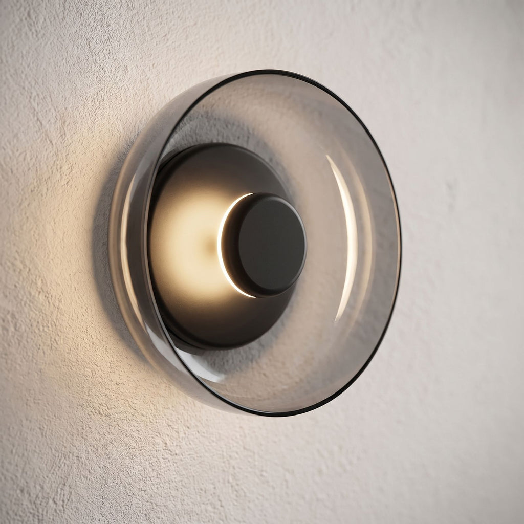 Round Glass Dish LED Wall Light, close view at 45 degrees on a plaster wall