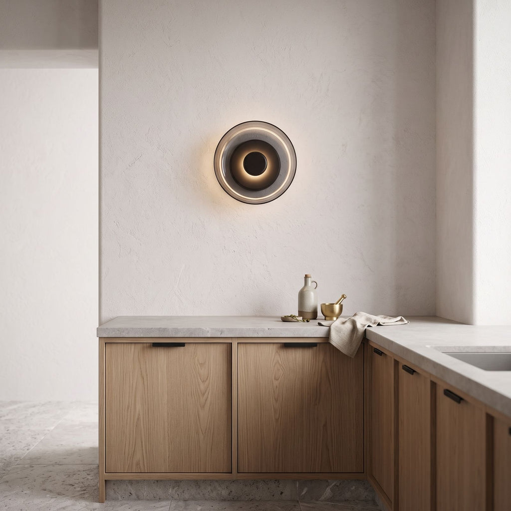 Round Glass Dish LED Wall Light on a kitchen wall