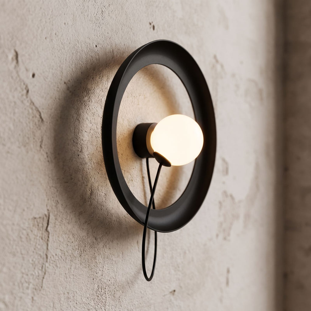 Round Iron Ring Wall Light with Magnetic Bulb, close view at 45 degrees on a plaster wall