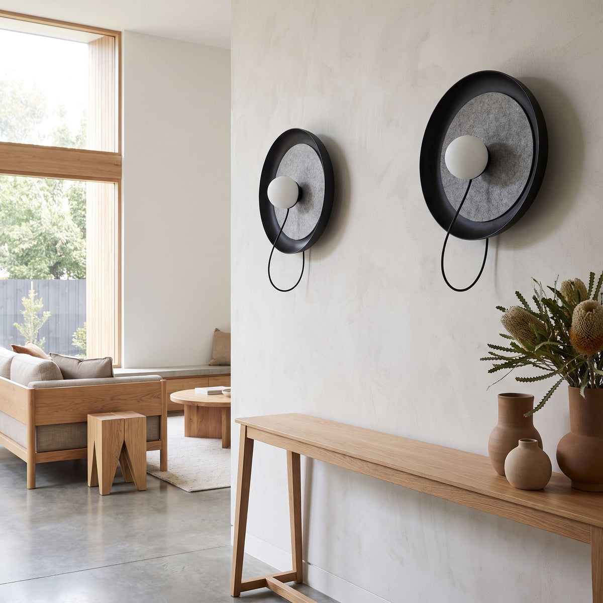 Round Iron Ring Wall Light with Magnetic Bulb in a pair on a wall of an Australian home
