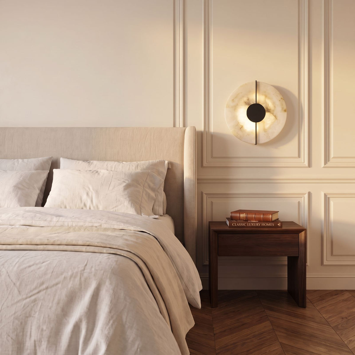 Round Marble and Metal LED Wall Light in black, beside a bed in a bedroom