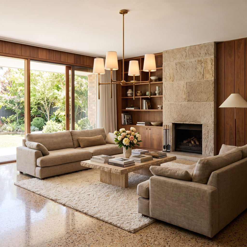 Round Metal Arm Tapered Shade Chandelier above a coffee table in a living room in daylight