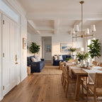 Round Metal Arm Tapered Shade Chandelier in an open-plan living and dining room, wide view