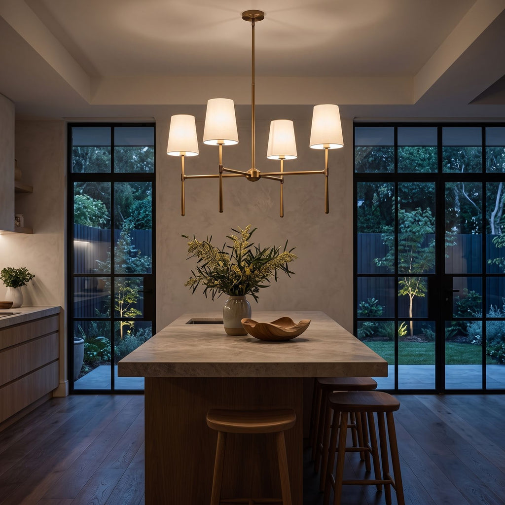 Round Metal Arm Tapered Shade Chandelier above a kitchen island at night