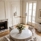 Round Metal Arm Tapered Shade Chandelier in a styled bedroom in soft daylight