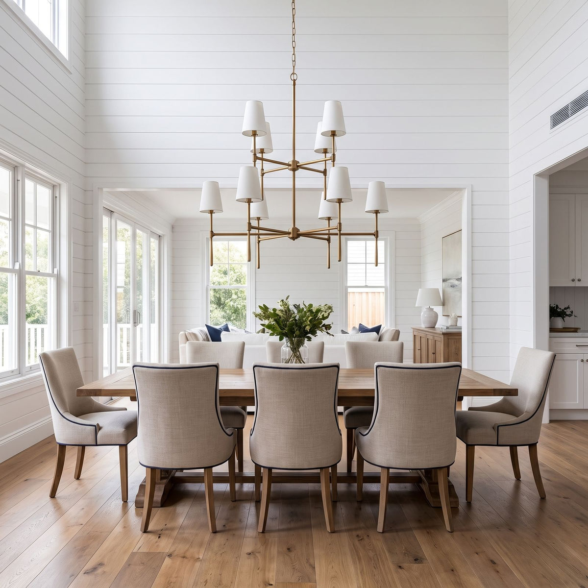 Round Metal Arm Tapered Shade Chandelier, 8 lights in 2 tiers, above a long dining table