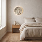 Round Natural Marble LED Wall Light on a bedroom wall beside the bed