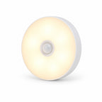 Round Rechargeable Motion Sensor Wall Light in Warm White on a white background