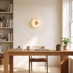Round Split Marble Disc LED Wall Light above an oak desk in a home office in daylight