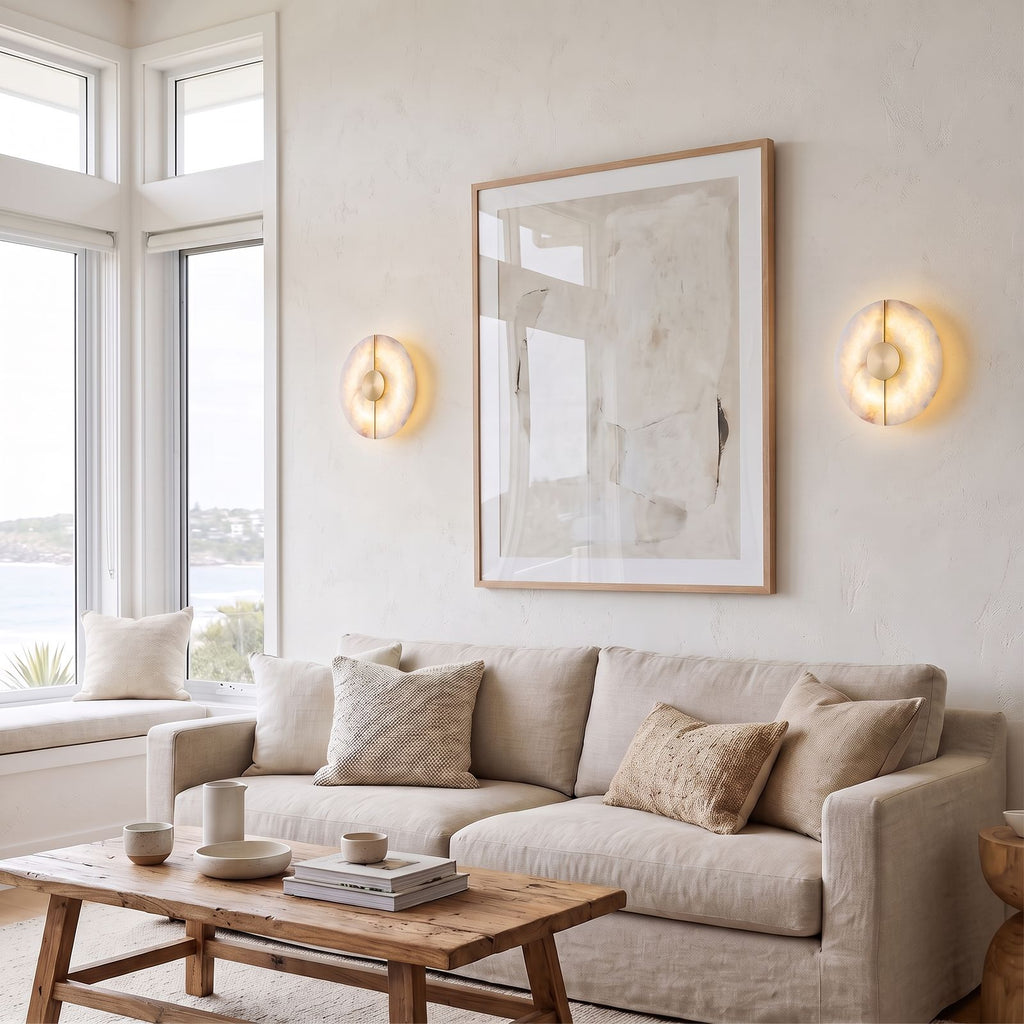 Round Split Marble Disc LED Wall Light pair either side of an artwork above a sofa in a coastal living room